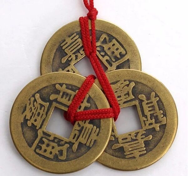coins with red threads for good luck