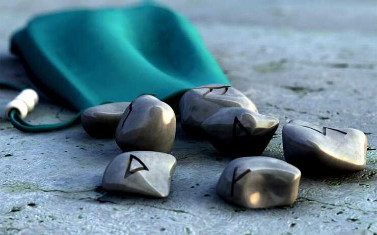 pouch with runes as charms for good luck